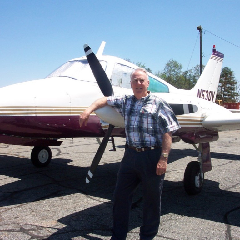 Don Stevens Don Stevens in front of an airplane on a runway