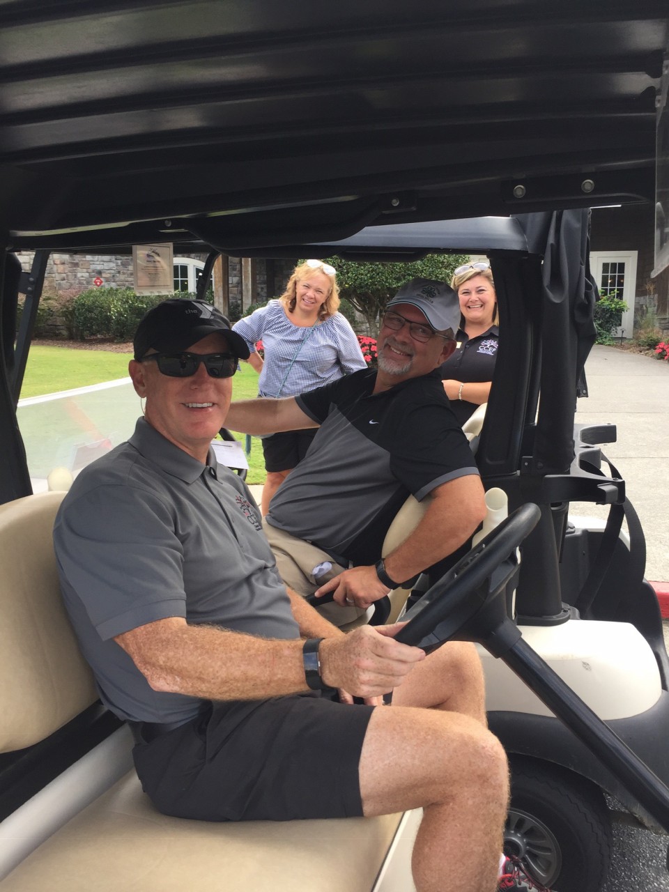 Board members on golf cart