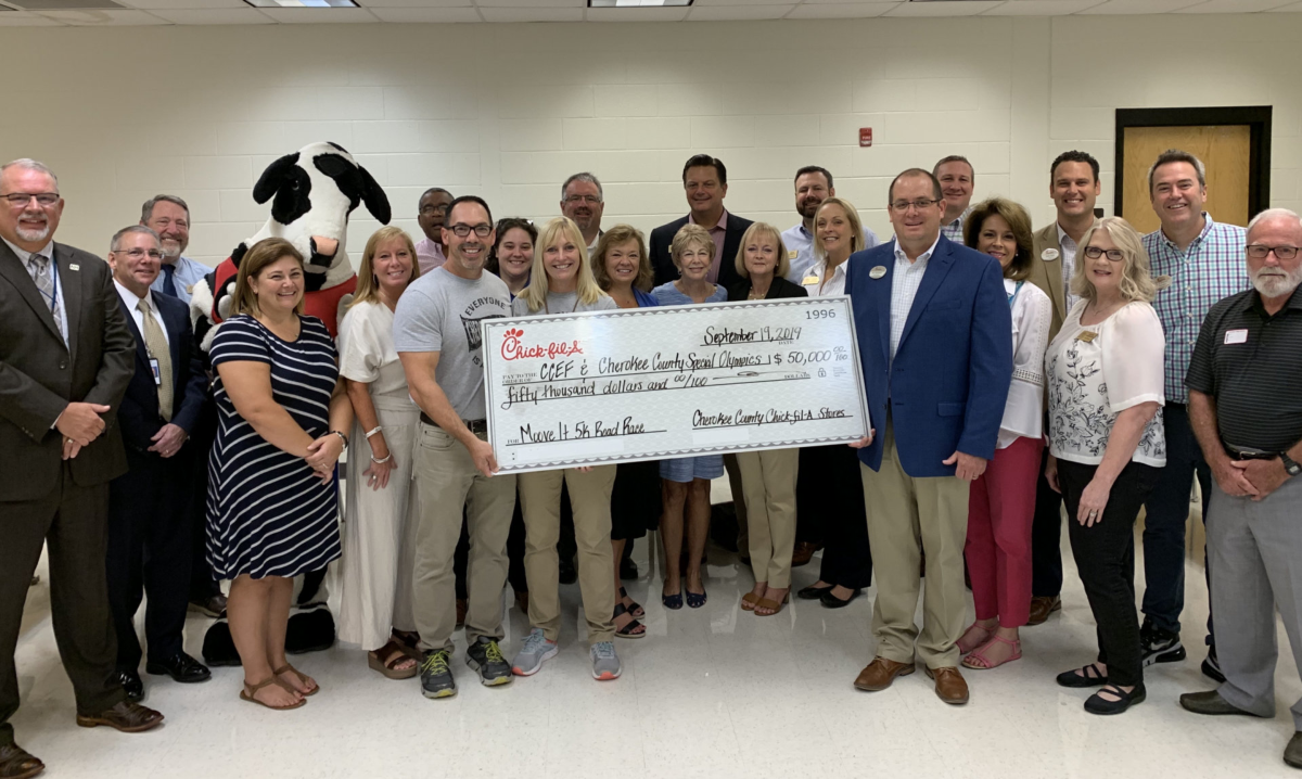 CCEF Board standing with $50,000 check from Chick-fil-A.